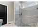 Bathroom glass enclosed shower with pebble tile floor at 5324 Stonewood Dr, Hickory, NC 28602