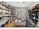 Large walk-in closet with open shelving, ottoman and yoga mat perfect for organizing and wellness at 5324 Stonewood Dr, Hickory, NC 28602