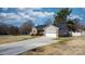 Long driveway leading to a brick home with well-maintained landscaping and a two-car garage at 5324 Stonewood Dr, Hickory, NC 28602
