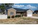 Brick home with a gray accent, a two-car garage, and a front yard with mature landscaping at 5324 Stonewood Dr, Hickory, NC 28602
