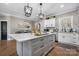 Kitchen island featuring a marble countertop and gray cabinetry at 5324 Stonewood Dr, Hickory, NC 28602