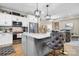Kitchen featuring an island with a marble countertop, pendant lighting, and hardwood floors at 5324 Stonewood Dr, Hickory, NC 28602