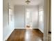 Light-filled bedroom featuring hardwood floors and an ensuite bathroom at 55 Academy Nw Ave, Concord, NC 28025
