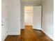 Hardwood floored bedroom features a neutral color palette and walk-in closet at 55 Academy Nw Ave, Concord, NC 28025
