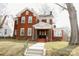 Classic brick home with a welcoming front porch and well-maintained lawn at 55 Academy Nw Ave, Concord, NC 28025