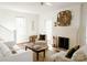 Inviting living room with hardwood floors, fireplace, and comfortable seating at 55 Academy Nw Ave, Concord, NC 28025