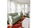 Bright living room featuring a comfy sofa, large windows, and stylish area rug at 55 Academy Nw Ave, Concord, NC 28025