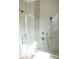 Modern shower featuring gray tile with mosaic accents and dual showerheads at 55 Academy Nw Ave, Concord, NC 28025