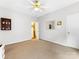 Bright bedroom featuring neutral walls, carpet, and a ceiling fan for a serene and comfortable living space at 5723 Whitehawk Hill Rd, Mint Hill, NC 28227