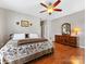 Spacious bedroom featuring hardwood floors, a ceiling fan, and neutral paint at 5723 Whitehawk Hill Rd, Mint Hill, NC 28227