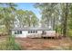 Charming home with a large back deck and wheelchair ramp, nestled on a lovely lot surrounded by mature trees at 608 Picketts Cir, Indian Trail, NC 28079