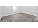 Bedroom features wood look flooring, neutral paint and a window for natural lighting at 63 3Rd Nw St, Concord, NC 28027