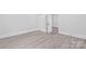 Bright bedroom with light wood-look floors, fresh paint, and white trim at 63 3Rd Nw St, Concord, NC 28027