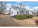 Exterior view of home featuring siding, roof, trimmed hedges, and minimal landscaping at 63 3Rd Nw St, Concord, NC 28027