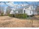 Charming exterior view of single Gathering home showing siding, roof, yard, and minimal landscaping at 63 3Rd Nw St, Concord, NC 28027