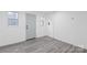 Room with wood look flooring, light walls and a small window for natural lighting at 63 3Rd Nw St, Concord, NC 28027