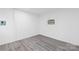 Unfurnished room features wood look floors, white walls and an air conditioning unit at 63 3Rd Nw St, Concord, NC 28027