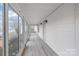 Spacious sunroom features large windows for ample natural light and a durable wood floor at 63 3Rd Nw St, Concord, NC 28027