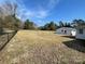 Large, open backyard with chain link fence and separate building in the rear at 7105 Nc Hwy 73 E Hwy, Mount Pleasant, NC 28124