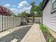 Landscaped backyard with a pathway, a hammock with pergola, and a privacy fence at 817 Digby Rd, Rock Hill, SC 29730