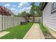 The backyard features a pergola with a hammock and a well-maintained lawn and garden at 817 Digby Rd, Rock Hill, SC 29730