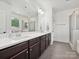 Bathroom featuring a double sink vanity, large mirror, and a glass enclosed shower at 817 Digby Rd, Rock Hill, SC 29730
