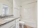 Bathroom featuring a granite vanity sink and a shower-tub combo at 817 Digby Rd, Rock Hill, SC 29730