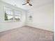 Well lit bedroom with neutral carpet, double hung windows and ceiling fan at 817 Digby Rd, Rock Hill, SC 29730