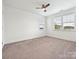 Well lit bedroom with neutral carpet, double hung windows and ceiling fan at 817 Digby Rd, Rock Hill, SC 29730