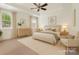 Stylishly staged bedroom with natural light, neutral tones, and a ceiling fan at 817 Digby Rd, Rock Hill, SC 29730