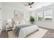 Stylishly staged bedroom with neutral tones, large windows, and modern decor at 817 Digby Rd, Rock Hill, SC 29730