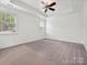 Spacious bedroom with tray ceiling, ceiling fan, neutral carpet, and double hung windows at 817 Digby Rd, Rock Hill, SC 29730
