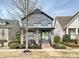 Charming two-story home featuring a bold green door, stone accents, and inviting front porch at 817 Digby Rd, Rock Hill, SC 29730