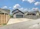 Charming home exterior featuring a driveway leading to a two-car garage at 817 Digby Rd, Rock Hill, SC 29730