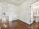Spacious front foyer featuring hardwood floors and an adjacent full bath with a pedestal sink at 817 Digby Rd, Rock Hill, SC 29730