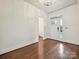 Bright foyer with hardwood floors, a white front door, and views into a connecting bathroom at 817 Digby Rd, Rock Hill, SC 29730