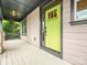 View of the home's covered front porch and bright green front door with glass windows at 817 Digby Rd, Rock Hill, SC 29730