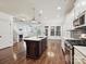 Open-concept kitchen with an island, hardwood floors, and a clear view into the living room at 817 Digby Rd, Rock Hill, SC 29730
