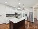 Modern kitchen featuring white cabinets, stainless appliances, and a central island at 817 Digby Rd, Rock Hill, SC 29730