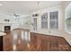 Bright and open living room with hardwood floors, fireplace and a view into the kitchen area at 817 Digby Rd, Rock Hill, SC 29730