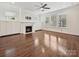Spacious living room with hardwood floors, a fireplace, built-in cabinets and many windows at 817 Digby Rd, Rock Hill, SC 29730
