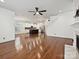 Open concept living room with hardwood floors leading to a modern kitchen and staircase at 817 Digby Rd, Rock Hill, SC 29730