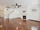 Open living room with hardwood floors, a fireplace, built-in cabinets and staircase to upper floors at 817 Digby Rd, Rock Hill, SC 29730