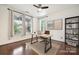 Bright office space featuring hardwood floors, natural light, and a stylish desk setup at 817 Digby Rd, Rock Hill, SC 29730
