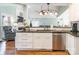 Well-lit kitchen featuring granite countertops, stainless steel appliances, and modern lighting fixtures at 8317 Poplar Grove Cir, Waxhaw, NC 28173