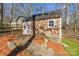 Exterior view of a storage shed surrounded by trees and meticulous landscaping at 8317 Poplar Grove Cir, Waxhaw, NC 28173