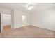 Spacious bedroom with carpet, ceiling fan, and access to bathroom and closet at 8500 Union Central Ct, Waxhaw, NC 28173