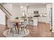 Bright kitchen with wooden chairs, wooden table, stainless appliances and granite counter tops at 8500 Union Central Ct, Waxhaw, NC 28173