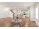 Spacious living area with hardwood floors leading into an open-concept kitchen at 8500 Union Central Ct, Waxhaw, NC 28173