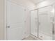 Modern bathroom featuring a glass-enclosed shower stall with white tile at 8500 Union Central Ct, Waxhaw, NC 28173